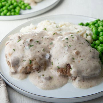 two meat patties topped with cream of mushroom soup to create steak supreme.