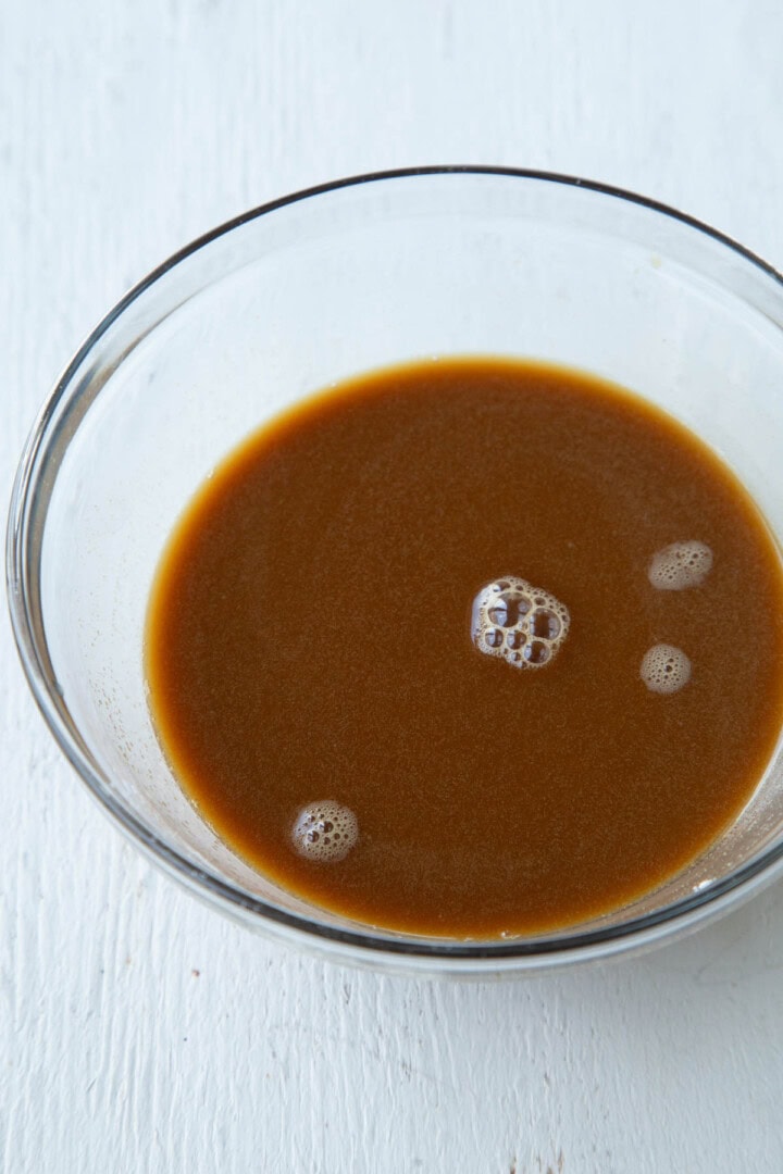 brown liquid including pineapple juice and soy sauce.