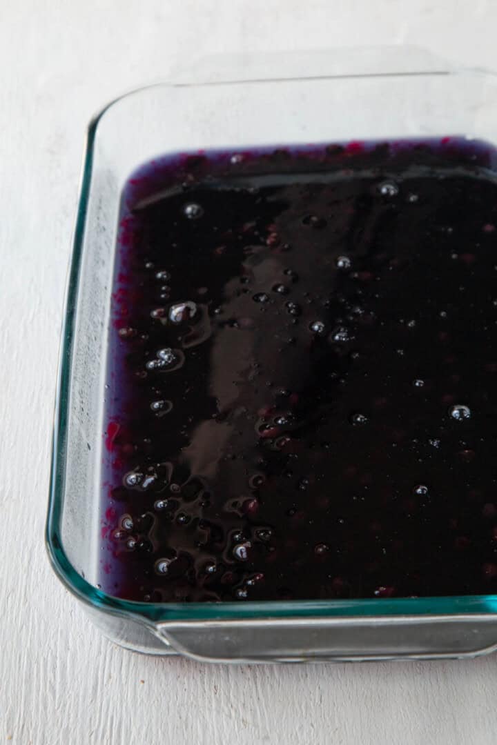 blue gelatin layer in a glass dish.