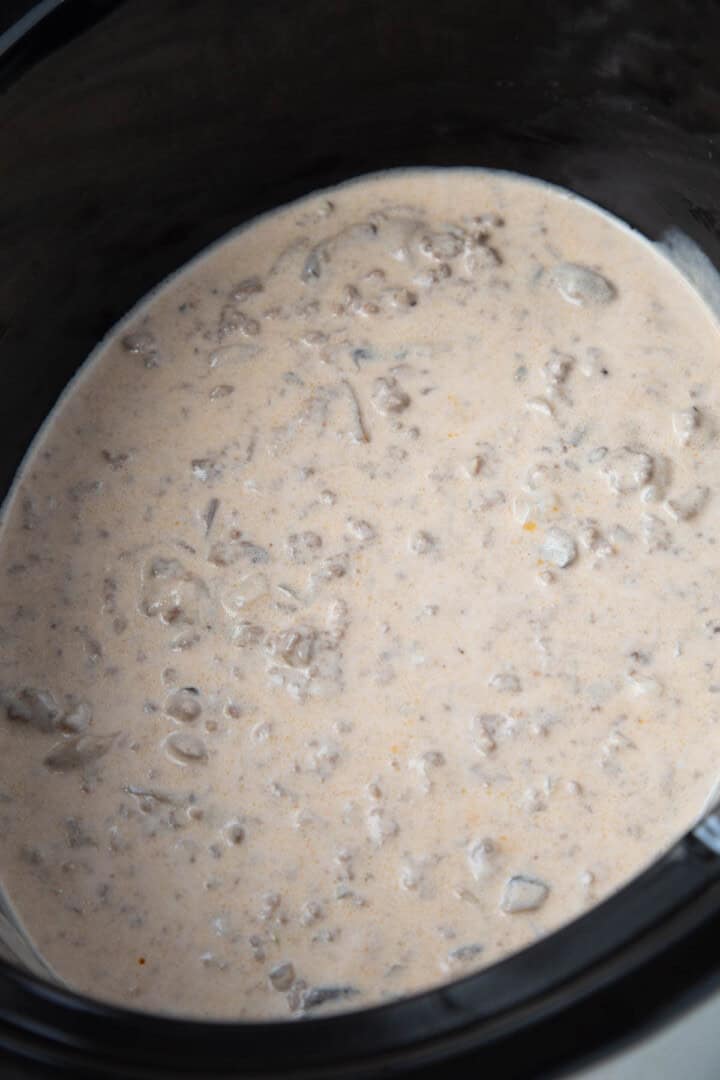 ground beef in a cream of mushroom sauce in a crockpot.