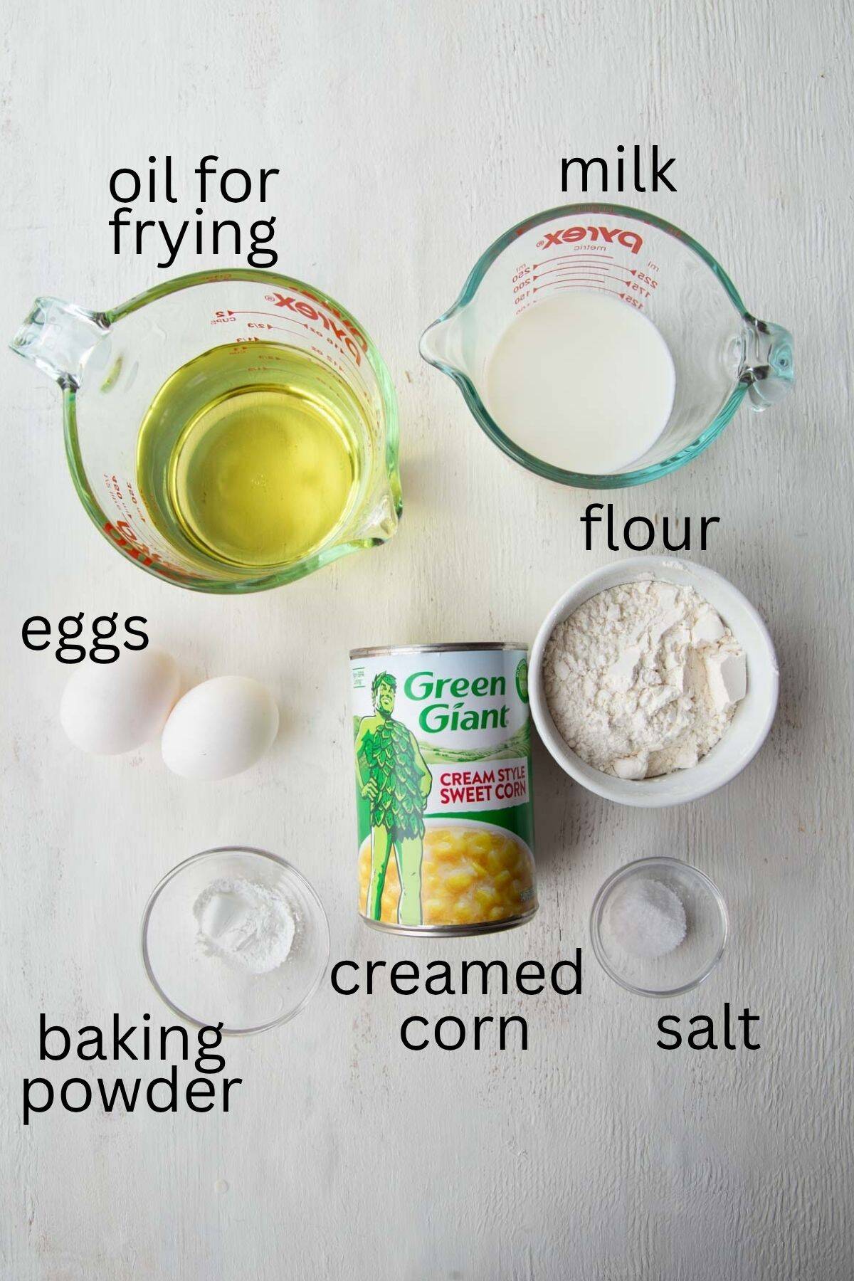a can of creamed corn, milk, flour, oil, eggs, and other ingredients.