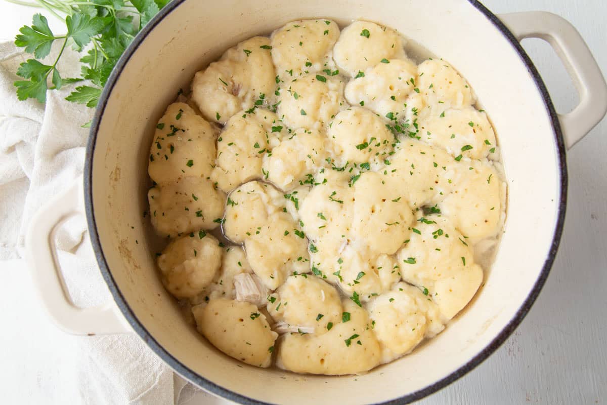 large pot filled with fluffy dumplings.