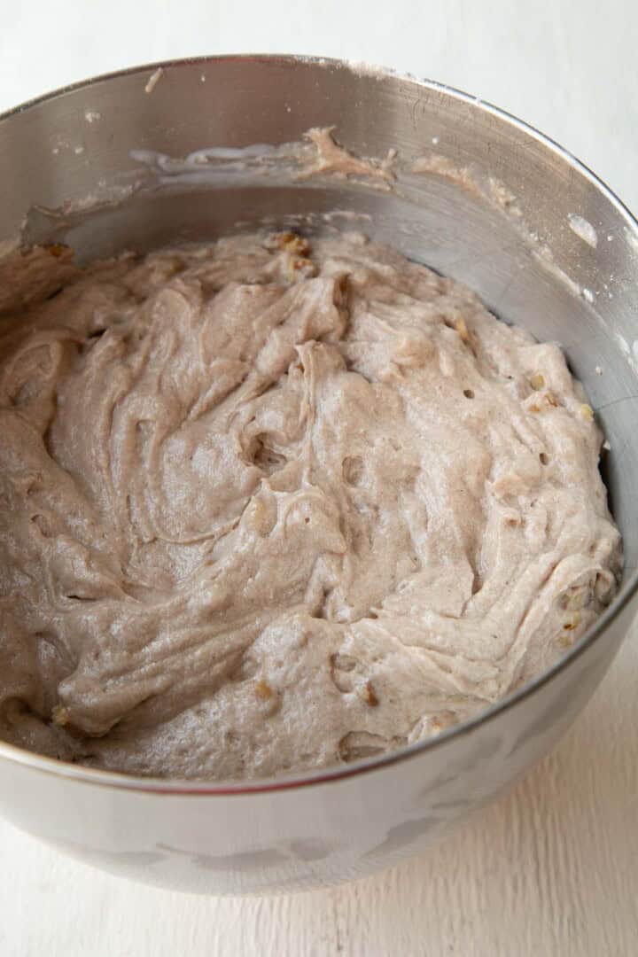 light purple colored cake batter in a metal bowl.