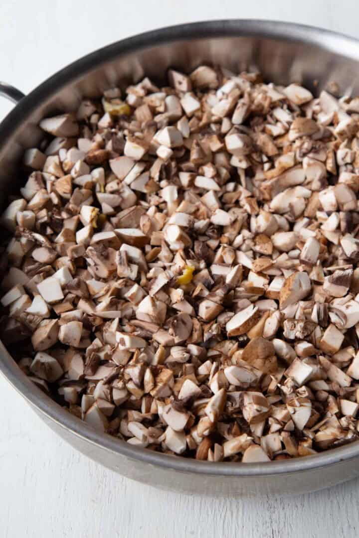 finely chopped mushrooms in a skillet.