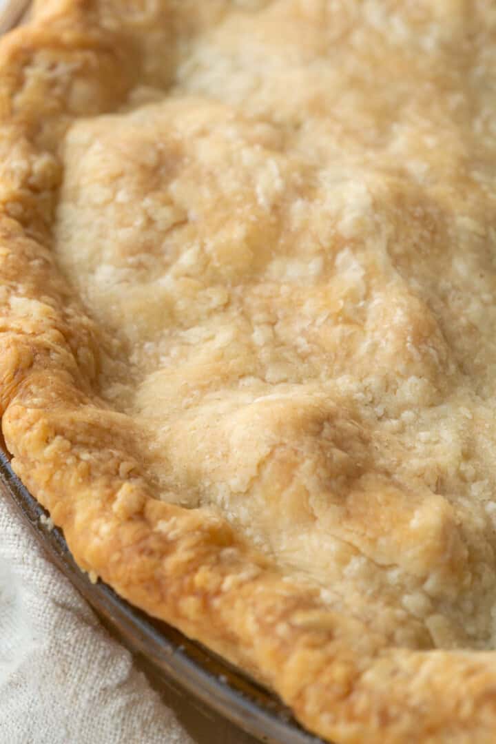 pie crust on top of a pie with a fluted edge.