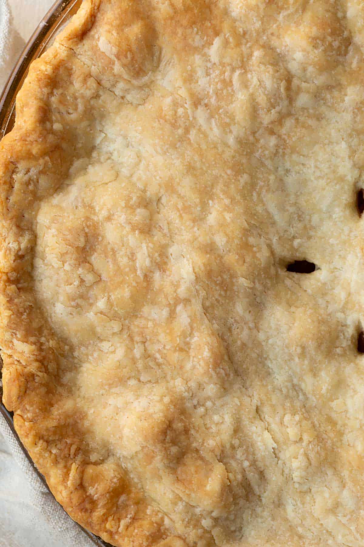 top of a pie covered with pie crust.