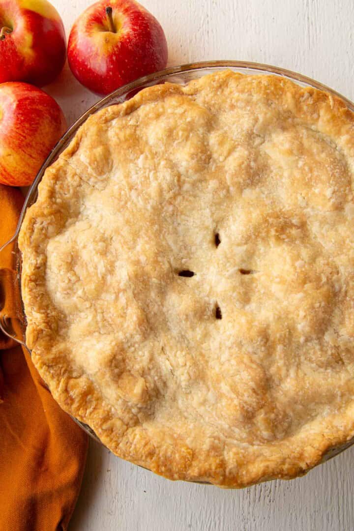 whole apple pie with a browned crust on top.
