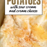baked mashed potatoes topped with butter and paprika.