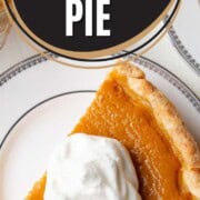 slice of pumpkin pie topped with a dollop of whipped cream.
