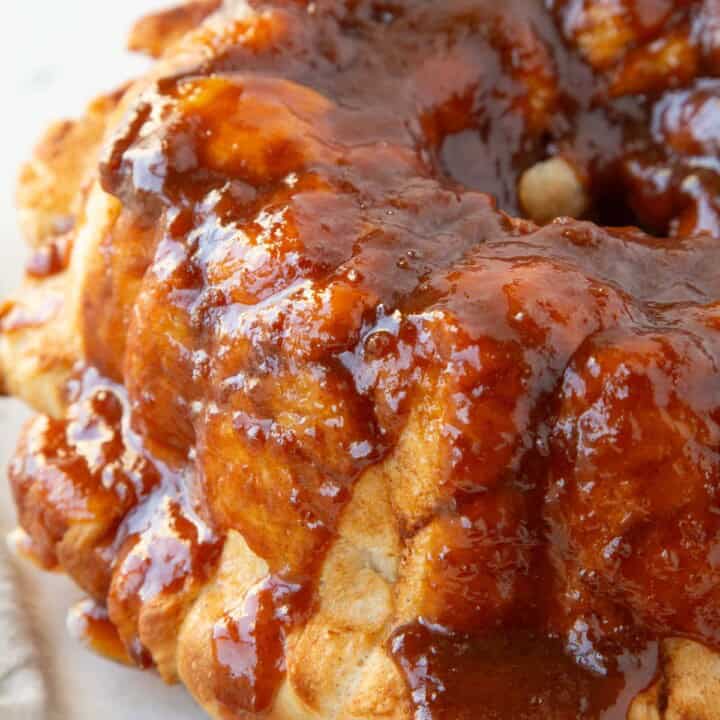 balls of baked bread in a bundt pan shape, covered with a toffee-colored butterscotch drizzle.