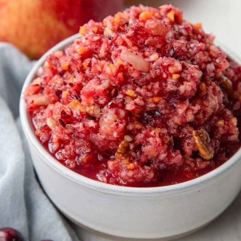 cranberry relish with chopped cranberries, bits of orange peel, pineapple, and chopped pecans.
