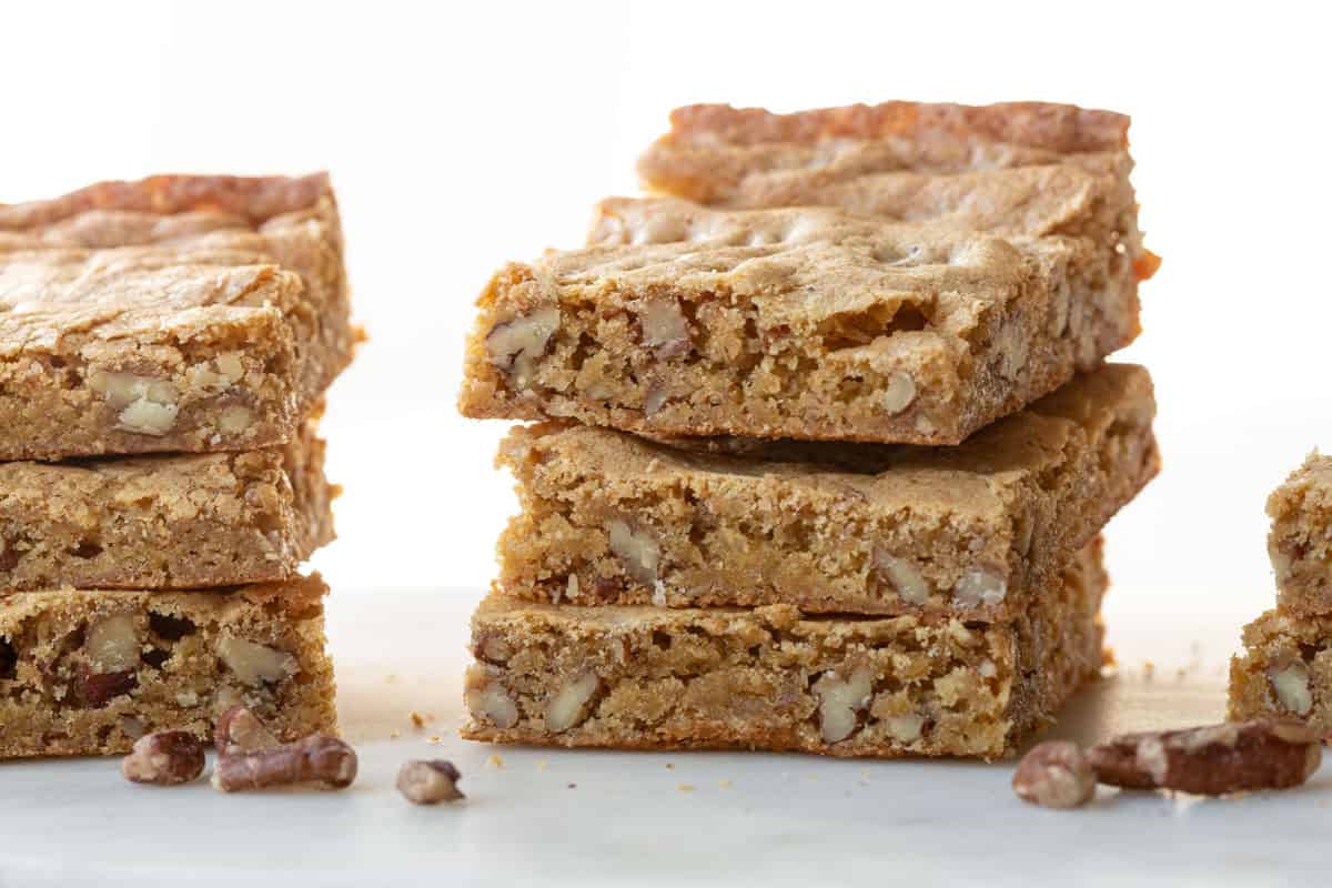 stack of blondie bars with pecans inside.