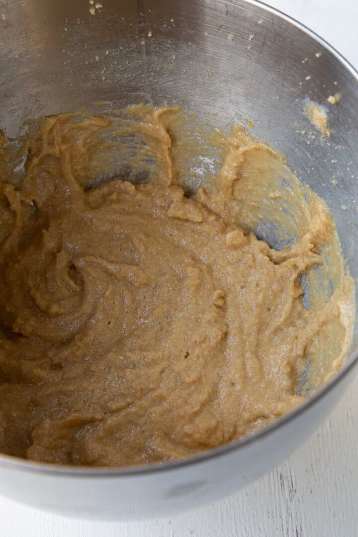butter, sugar, and egg mixed in a mixing bowl.