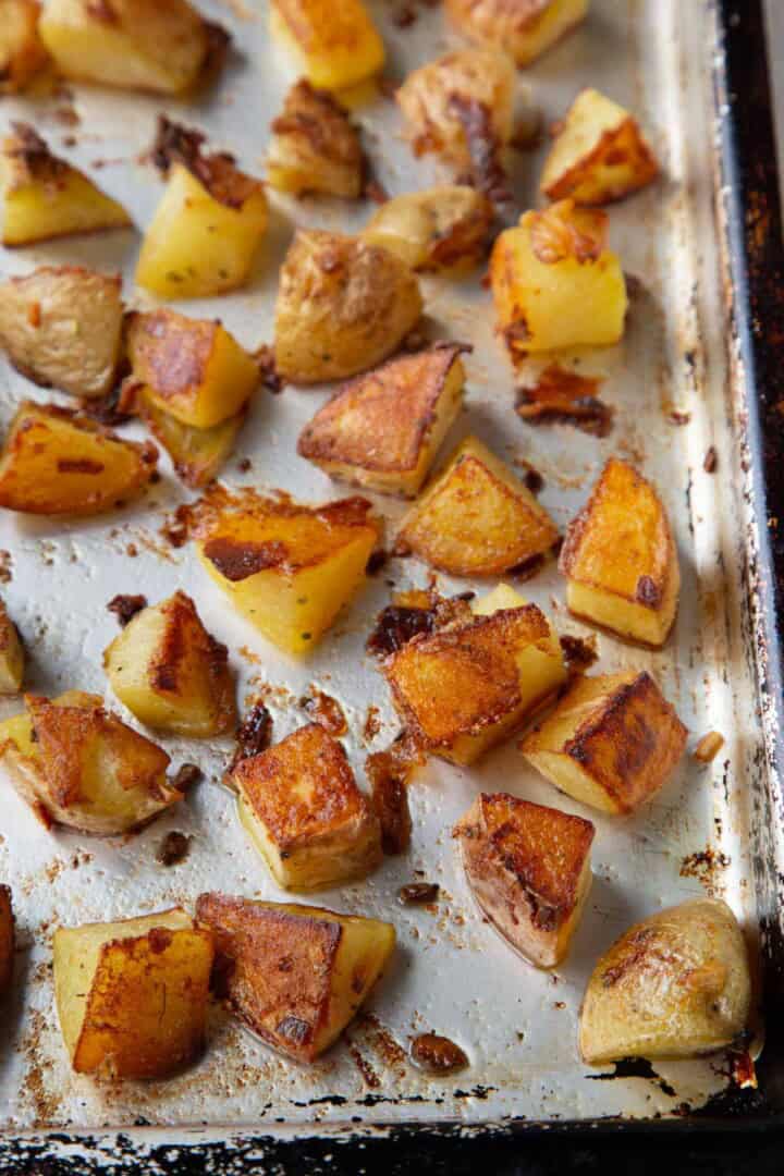 crispy roasted potatoes on a baking sheet.