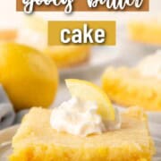 slice of lemon cake with a yellow crust and yellow filling, topped with a dollop of whipped cream and a wedge of lemon.
