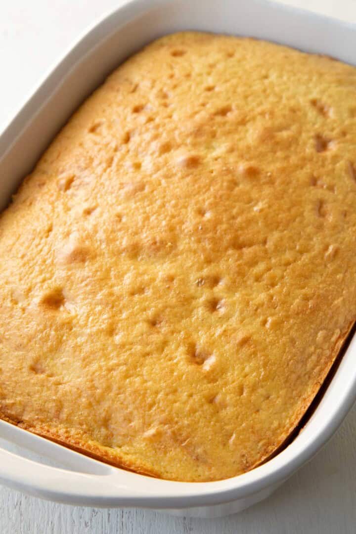 baked yellow cake in a baking dish.