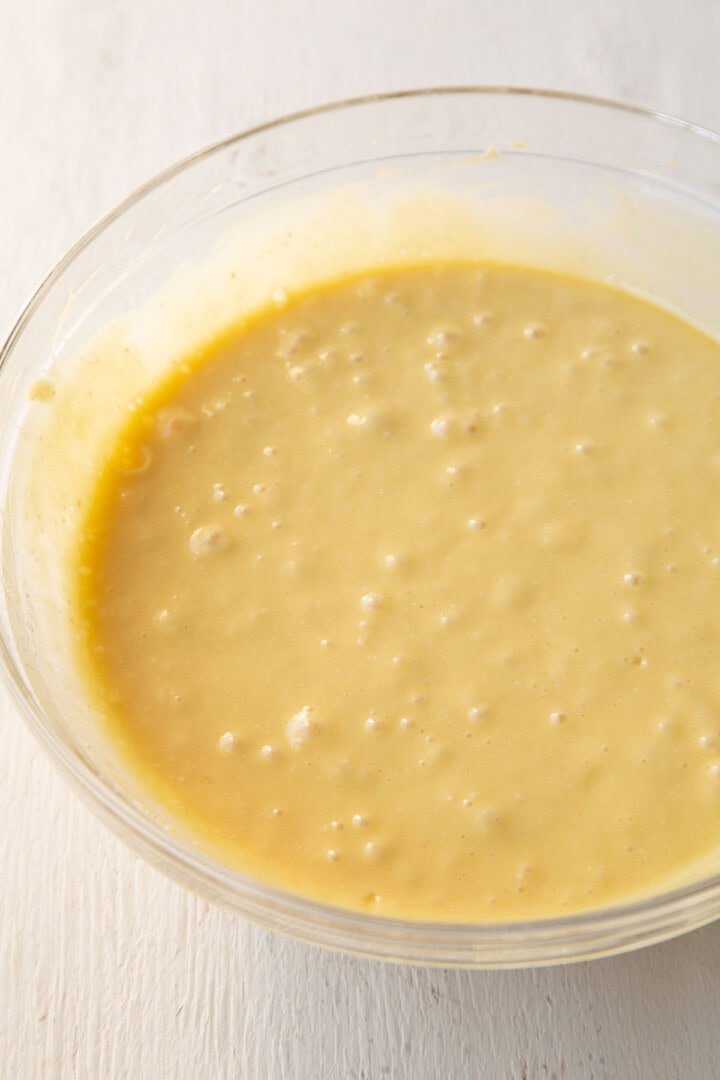 yellow cake batter in a glass bowl.