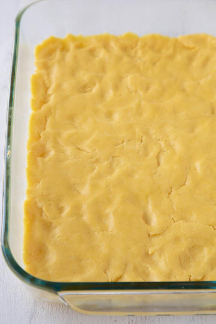 cake mix and butter mixture pressed into a crust in a glass pan.