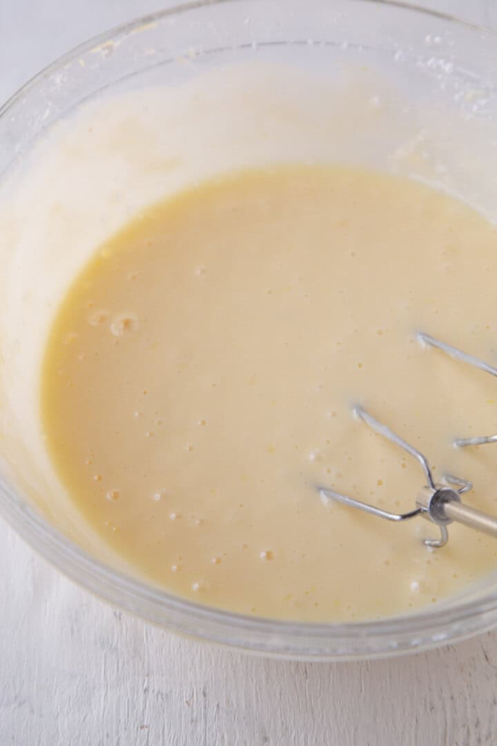 cream cheese liquid mixture in a glass bowl.