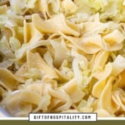 shredded cabbage and egg noodles in a lightly creamy sauce in a skillet.