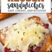 mini reuben sandwiches with a square of toasted rye bread topped with corned beef and melted swiss cheese.