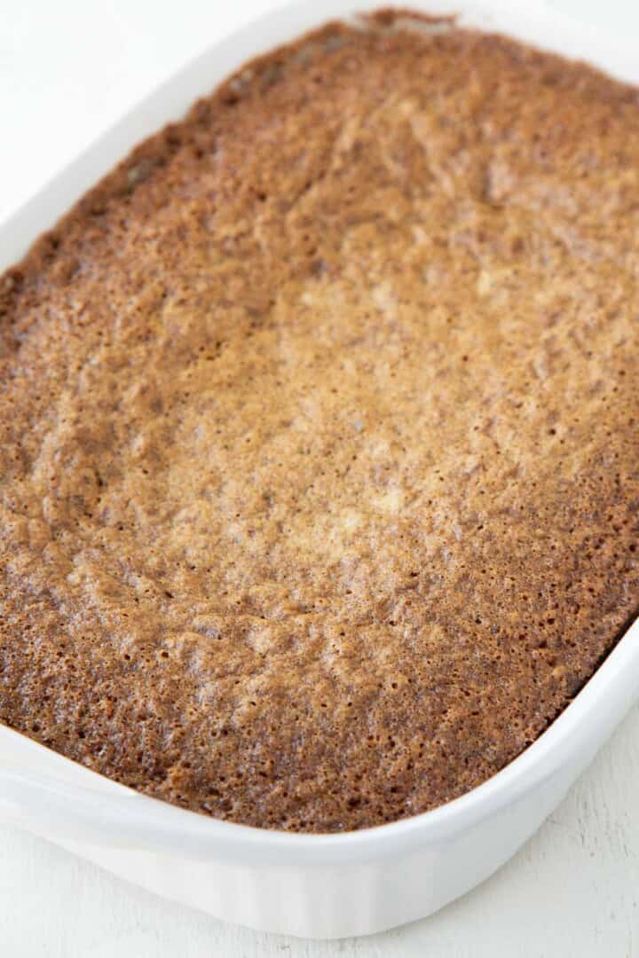 baked carrot cake in a white baking dish.