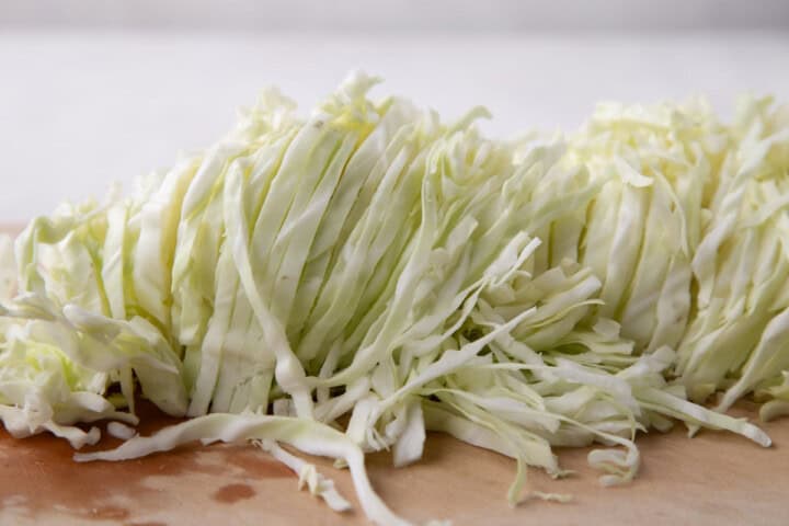 a pile of thinly shredded cabbage.