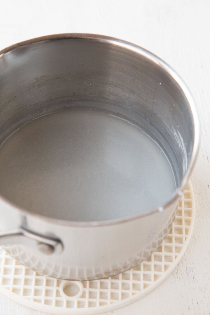 somewhat clear mixture in a saucepan made with cornstarch and water.