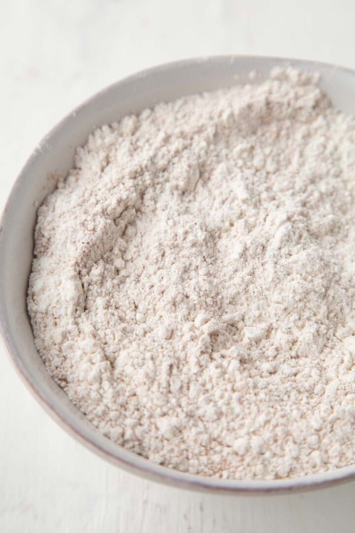 flour and cinnamon mixture in a metal bowl.