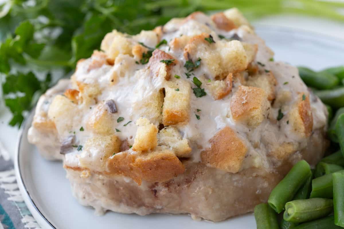 pork chop topped with stuffing and cream of mushroom soup.