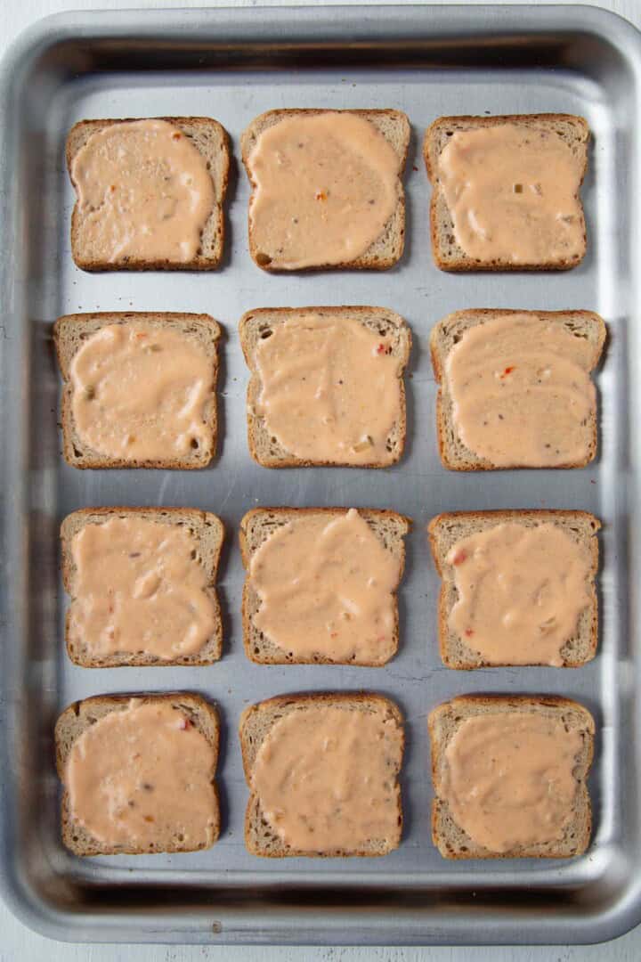 rye bread squares topped with thousand island dressing.