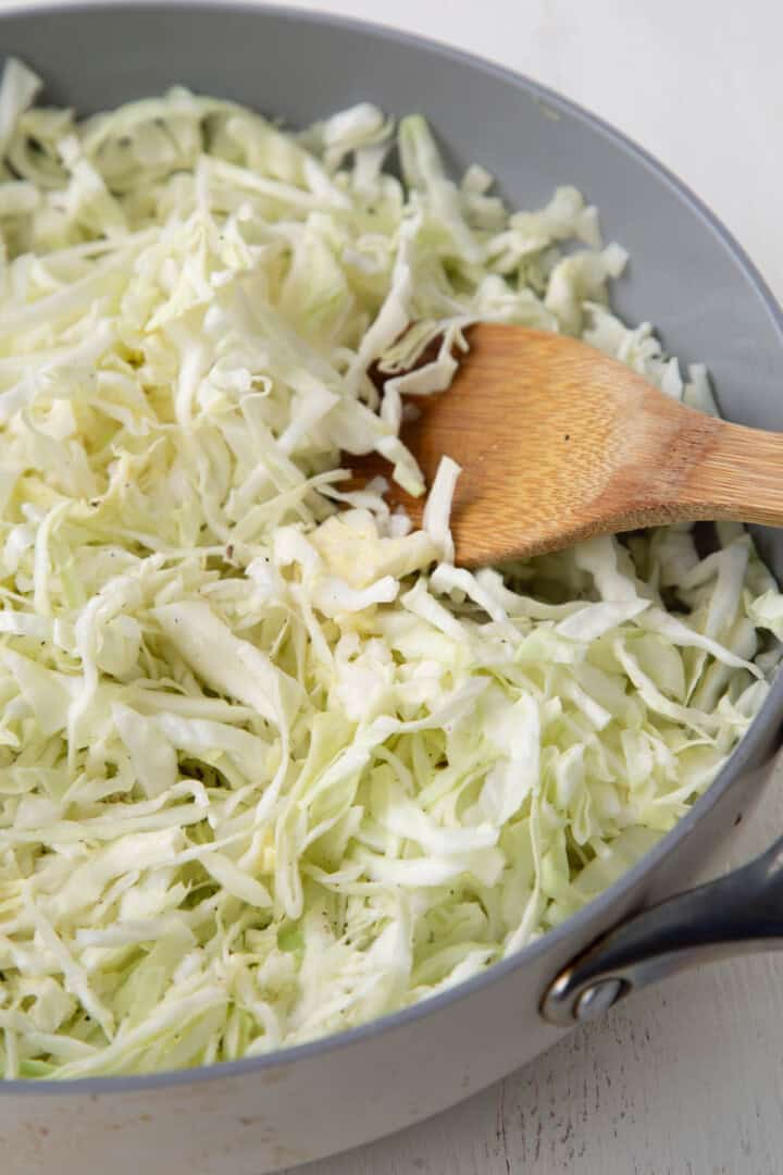 uncooked cabbage in a skillet.