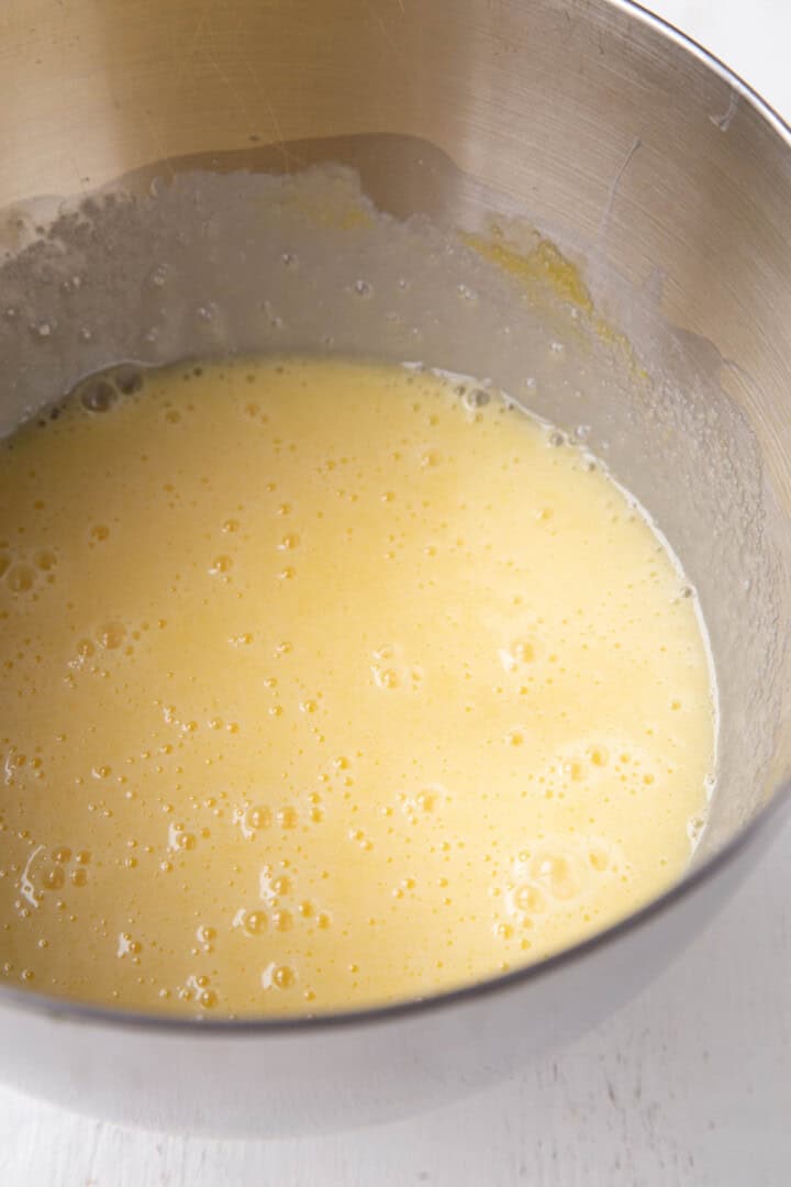 yellow cake batter in a metal bowl.