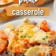 a scoop of a creamy casserole including ground beef in a creamy sauce, topped with chopped potatoes and chopped carrots, and cheese on top.
