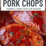 pork chops topped with bbq sauce in a baking dish.