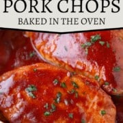 pork chops topped with bbq sauce in a baking dish.