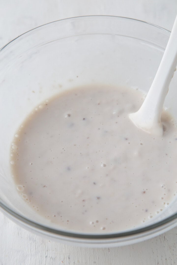cream of mushroom soup and milk mixed together in a bowl.