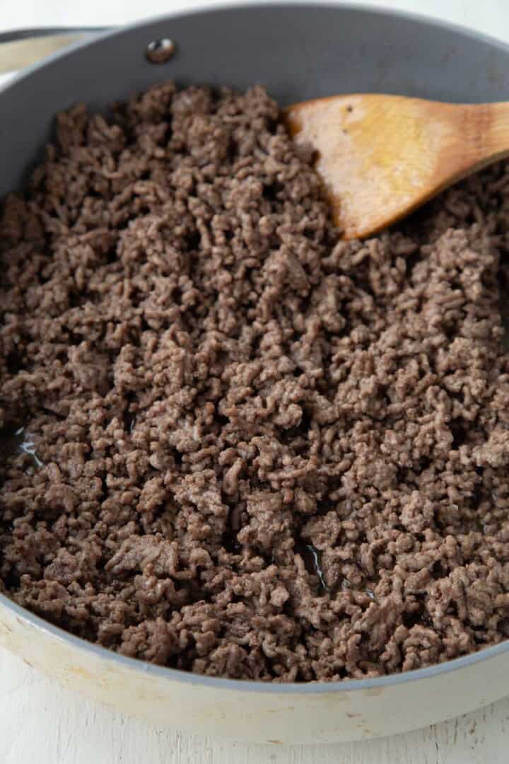 browned ground beef and onion in a skillet.