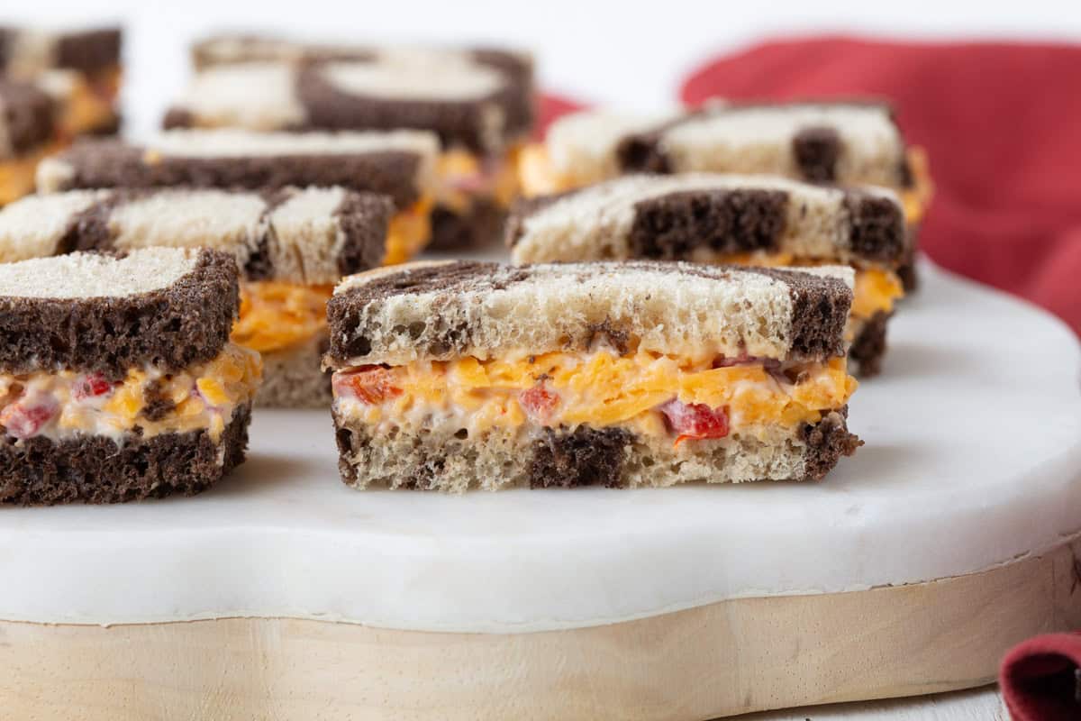 pimento cheese on marble rye, cut into finger sandwiches.