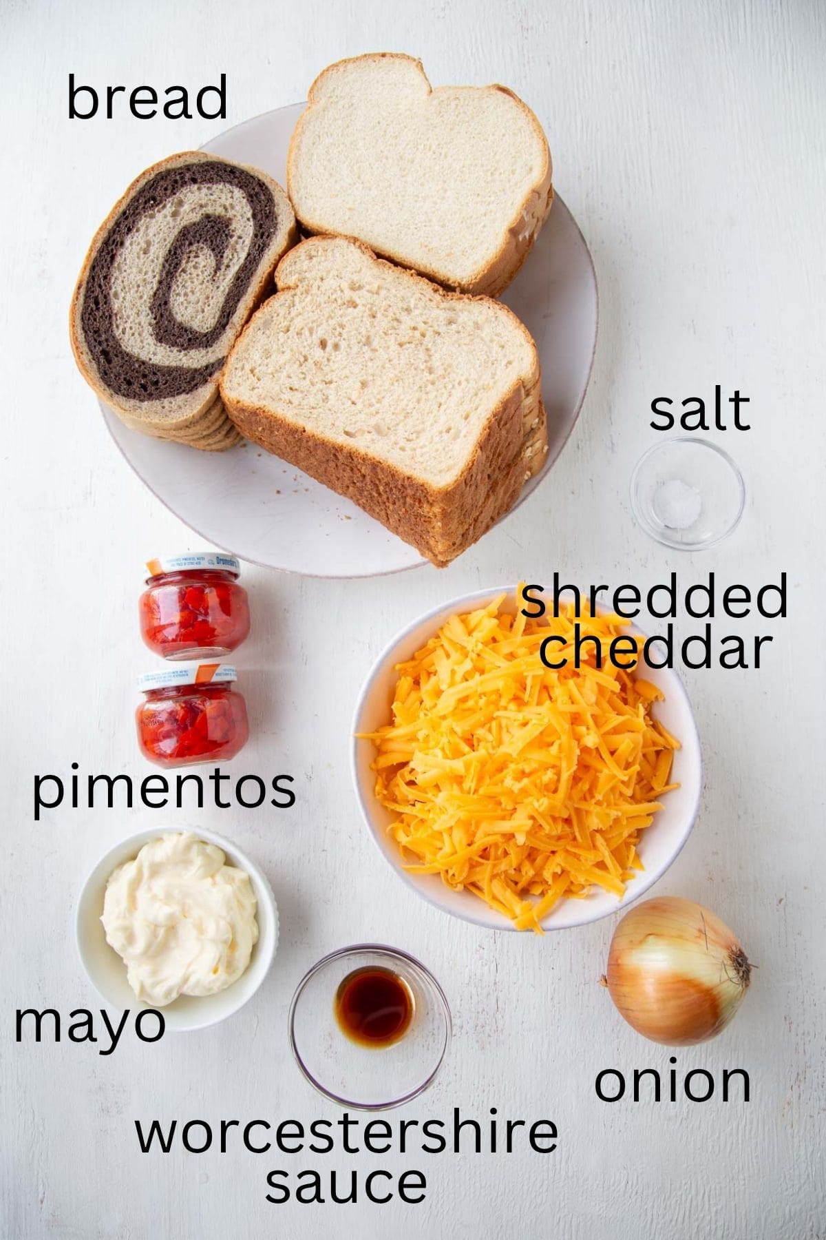 bread, shredded cheddar, pimentos, and other ingredients.