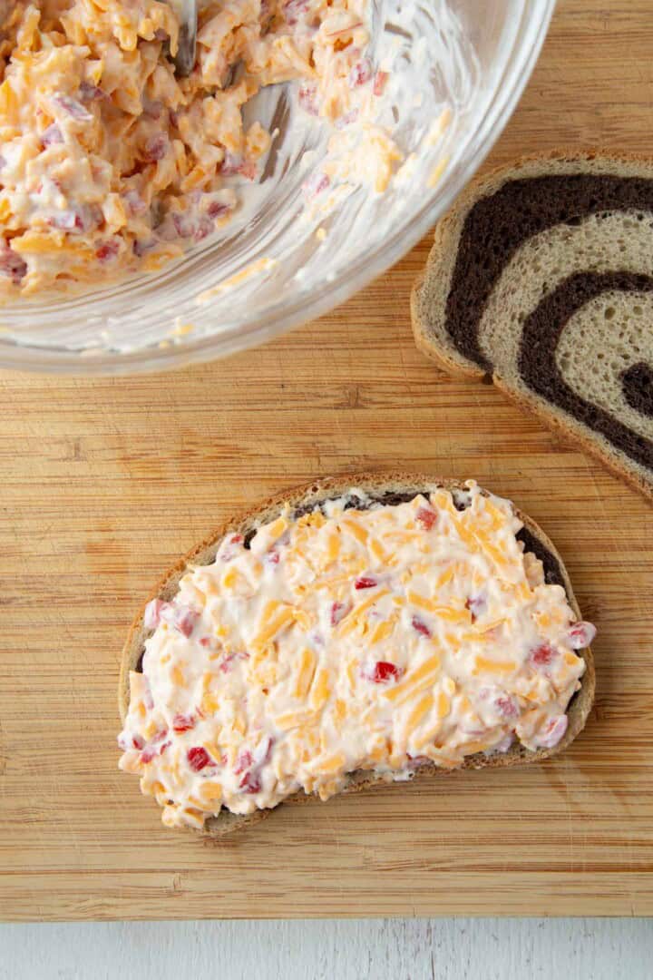 pimento cheese spread on a slice of marble rye.