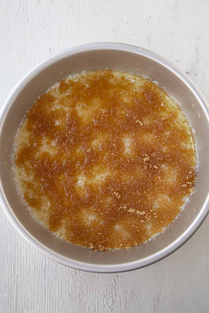 brown sugar and melted butter in a round cake pan.
