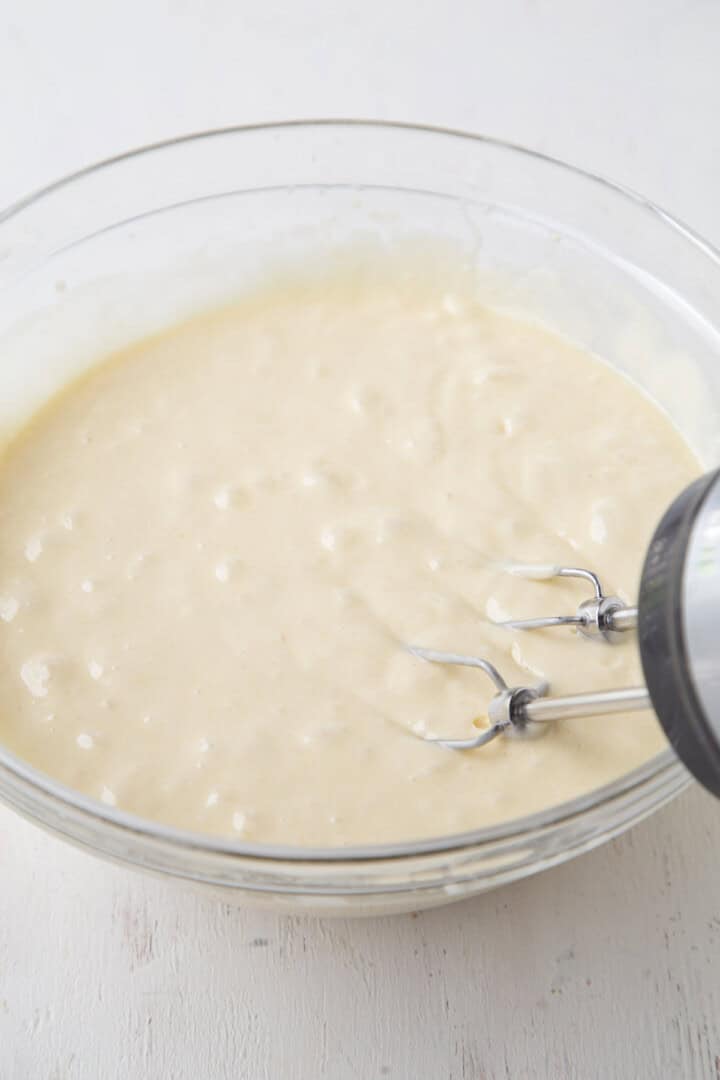 white cake batter in a glass bowl.
