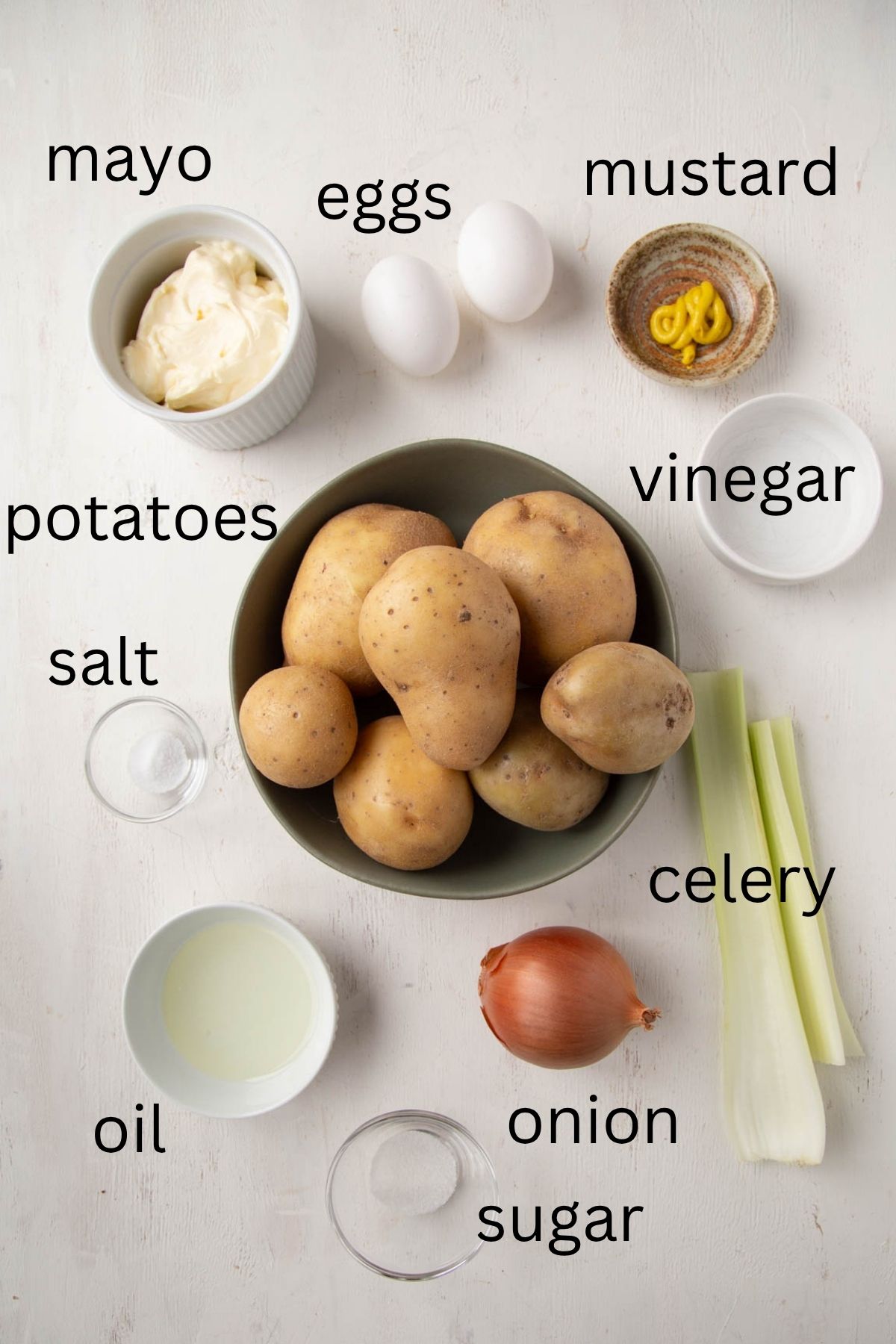 potatoes, mayo, hard boiled eggs, celery, and more ingredients.