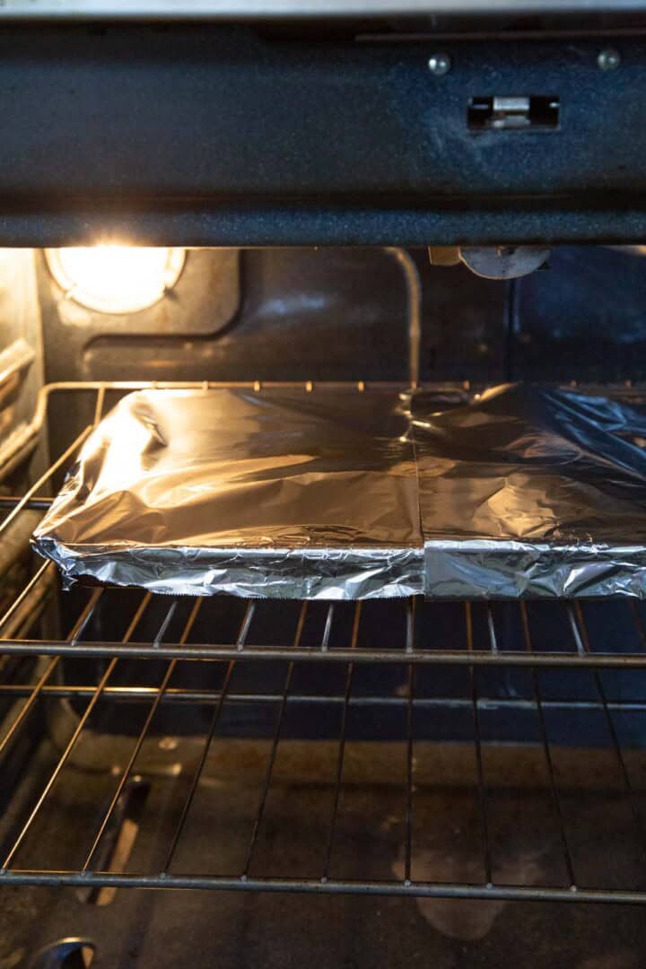 pan covered with foil in the oven.
