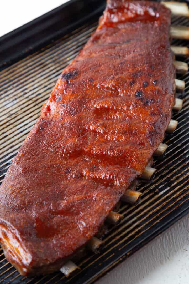 rack of saint louis style ribs on a sheet pan.