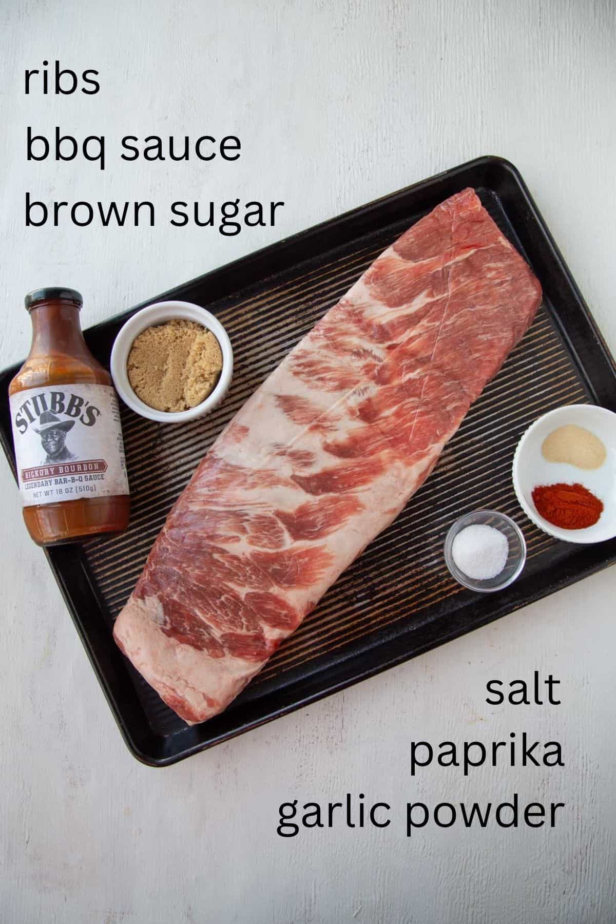 a rack of ribs with bbq sauce, brown sugar, salt, and spices.