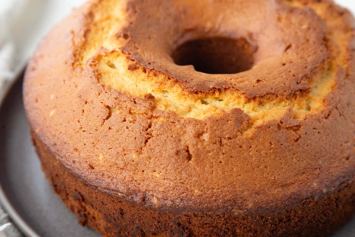 whole 1-2-3-4 cake on a gray platter.