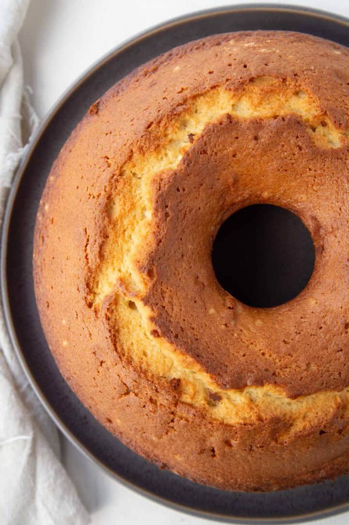 whole baked 1-2-3-4 pound cake in a metal tube pan.