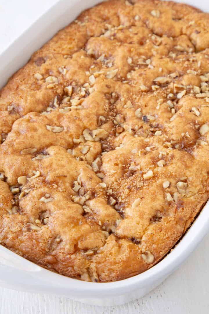 baked ugly duckling cake with walnuts on top.